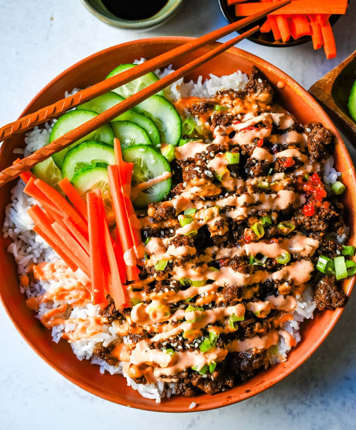 These Easy Korean Beef Bowls are a flavorful dinner that come together in just 20 minutes. Made with ground beef, garlic, ginger, soy sauce, sesame oil, and brown sugar or honey, all served over fluffy white rice.
