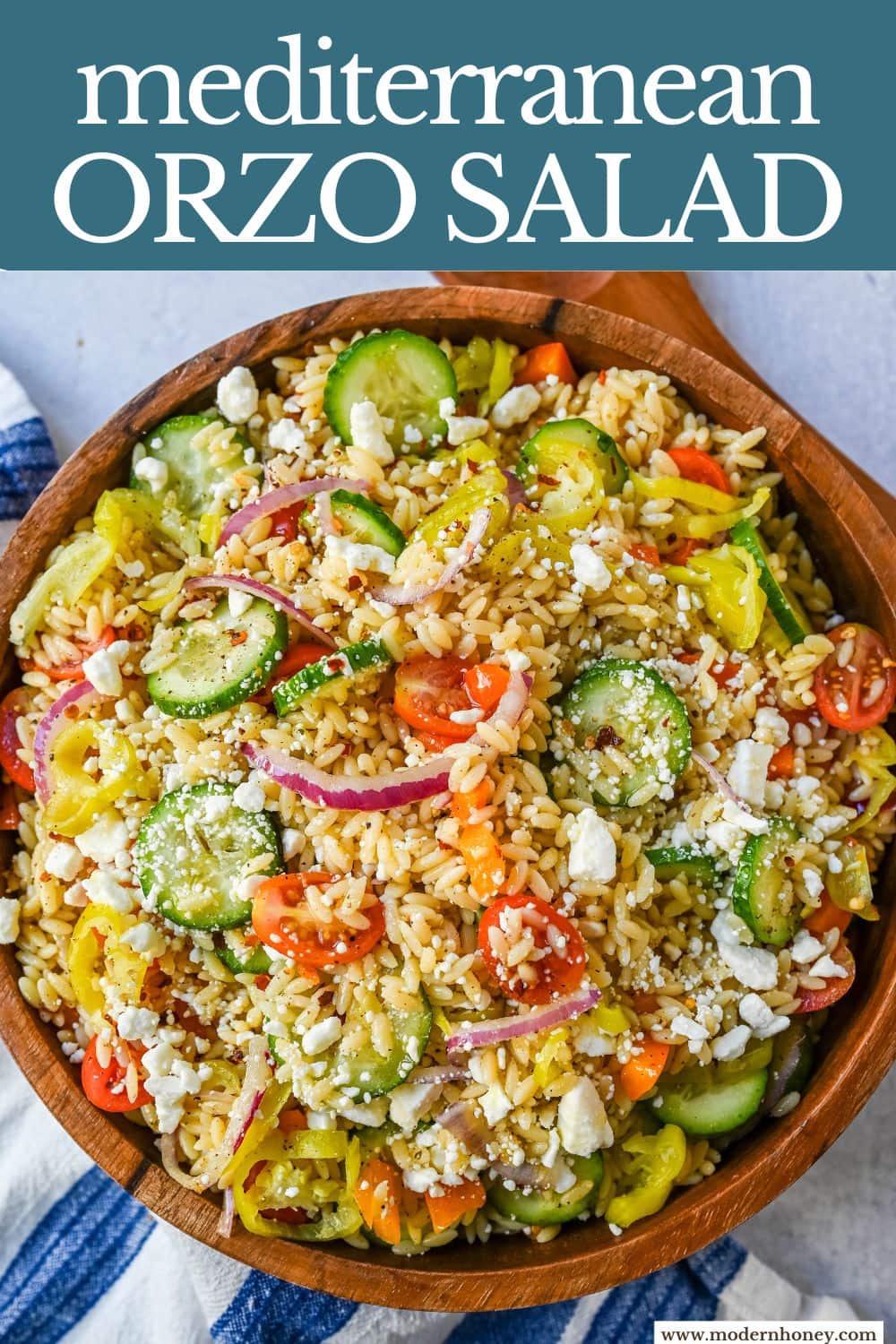 Fresh Mediterranean Orzo Salad made with a bright greek oregano dressing, orzo pasta, crisp cucumber, cherry tomatoes, red onion, feta cheese, and pepperoncinis. This greek orzo pasta salad recipe is perfect for summer or meal prep!