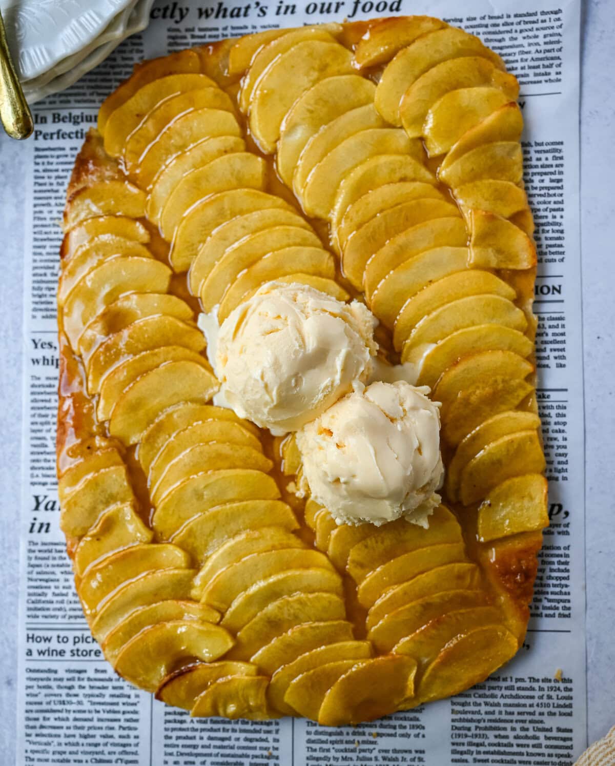 This homemade French Apple Tart recipe features a buttery crust, thinly sliced Granny Smith apples, and a golden apricot glaze for a bakery-style dessert. This Ina Garten French Apple Tart recipe is the best apple tart recipe, perfect for entertaining, holidays or any Fall baking.