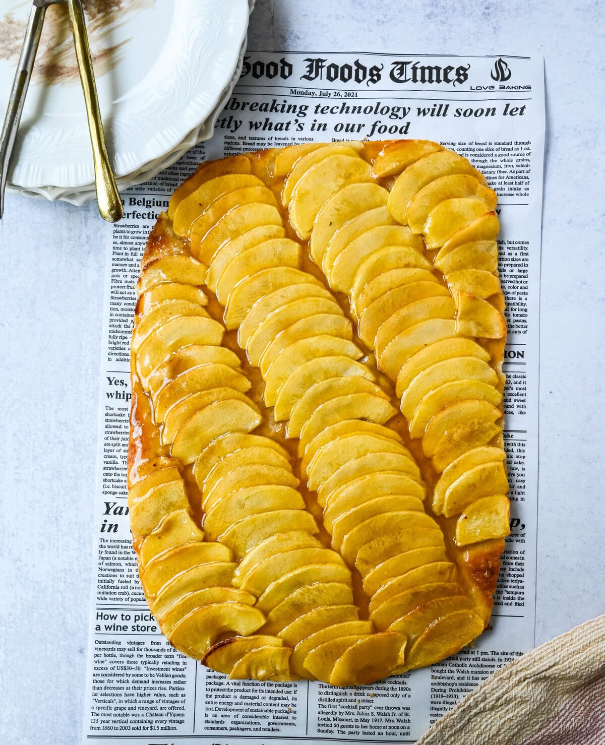 This homemade French Apple Tart recipe features a buttery crust, thinly sliced Granny Smith apples, and a golden apricot glaze for a bakery-style dessert. This Ina Garten French Apple Tart recipe is the best apple tart recipe, perfect for entertaining, holidays or any Fall baking.