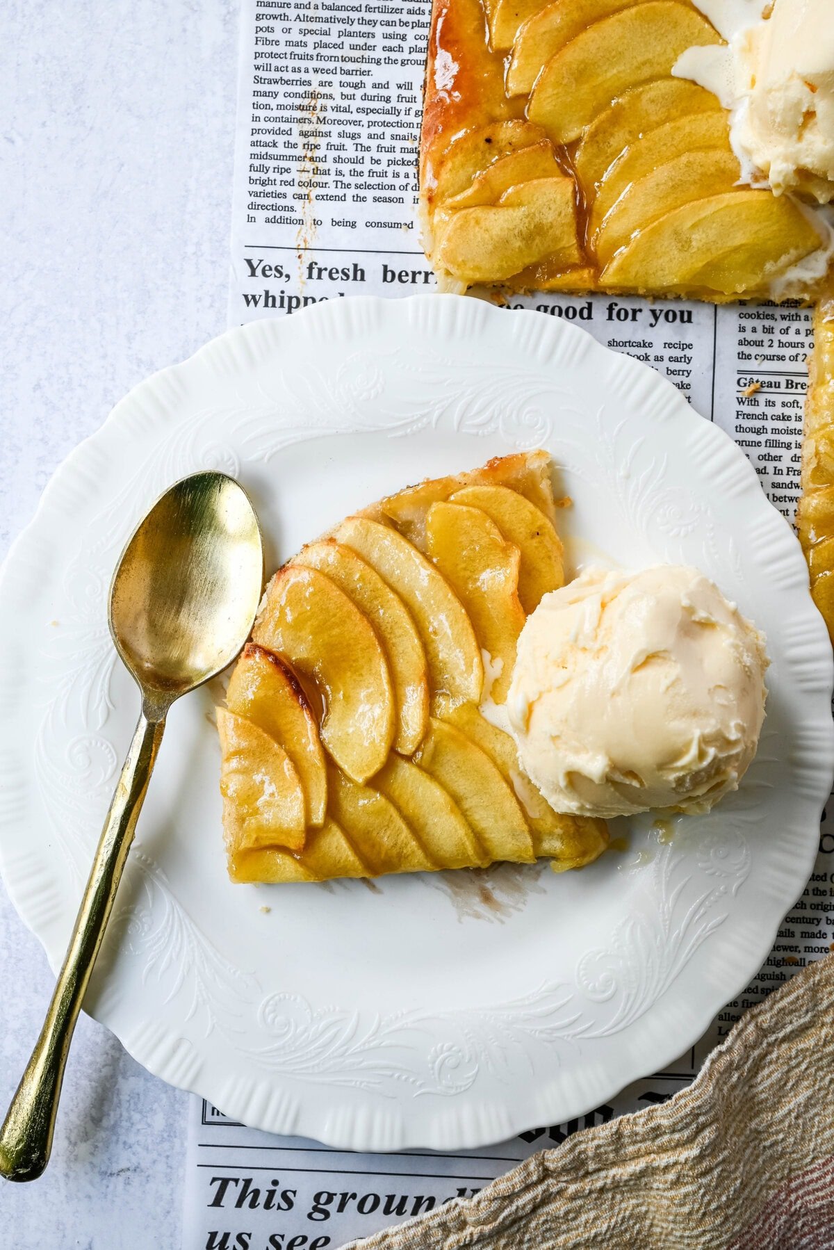 This homemade French Apple Tart recipe features a buttery crust, thinly sliced Granny Smith apples, and a golden apricot glaze for a bakery-style dessert. This Ina Garten French Apple Tart recipe is the best apple tart recipe, perfect for entertaining, holidays or any Fall baking.