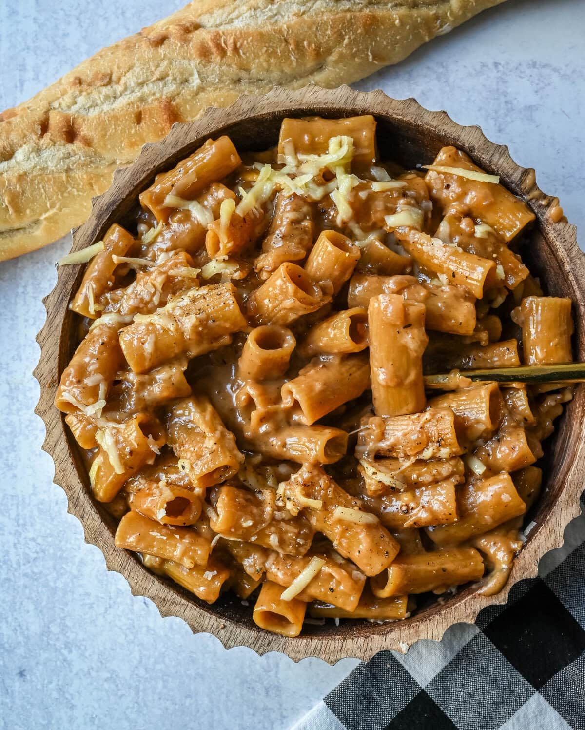 This One Pot French Onion Pasta takes everything you love about French onion soup and turns it into a creamy and cheesy pasta dish. This popular dinner recipe on TikTok is made in just one pot, with caramelized onions, garlic, thyme, and pasta simmered in a savory creamy broth, then topped with Gruyère and Parmesan cheese.