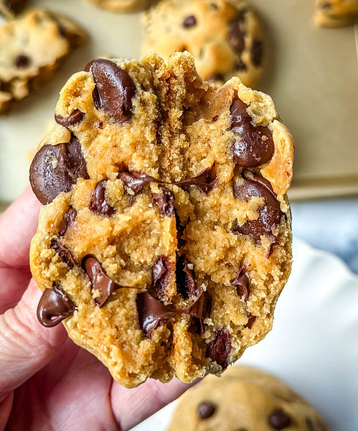 Rich, thick, and soft, these peanut butter chocolate chip cookies taste just like Levain Bakery but made at home. These Levain Bakery Peanut Butter Dark Chocolate Chip cookies are the perfect soft peanut butter chocolate chunk cookie!