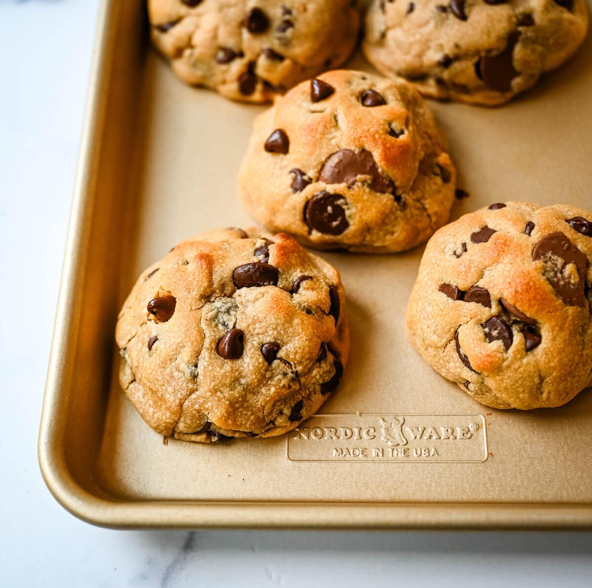 Rich, thick, and soft, these peanut butter chocolate chip cookies taste just like Levain Bakery but made at home. These Levain Bakery Peanut Butter Dark Chocolate Chip cookies are the perfect soft peanut butter chocolate chunk cookie!