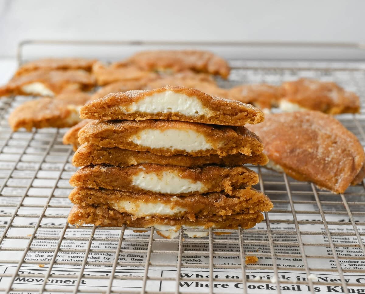 These soft, chewy, pumpkin spice cookies are filled with a cheesecake filling. They are the perfect pumpkin cookie filled with a sweet cream cheese center and rolled into cinnamon sugar. You will love this Best Pumpkin Cheesecake Cookie Recipe!
