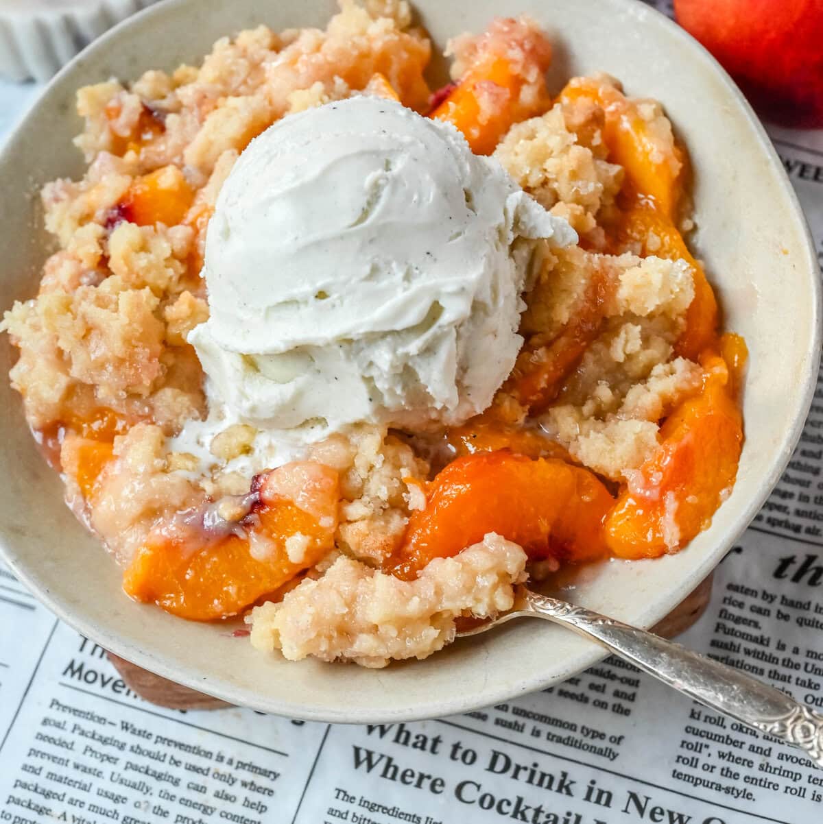 This Homemade Sugar Cookie Peach Cobbler is made with juicy peaches tossed in sugar and topped with a soft, buttery sugar cookie crust, then baked until golden. Serve it warm with a scoop of vanilla ice cream for the best peach cobbler recipe with a sugar cookie twist!