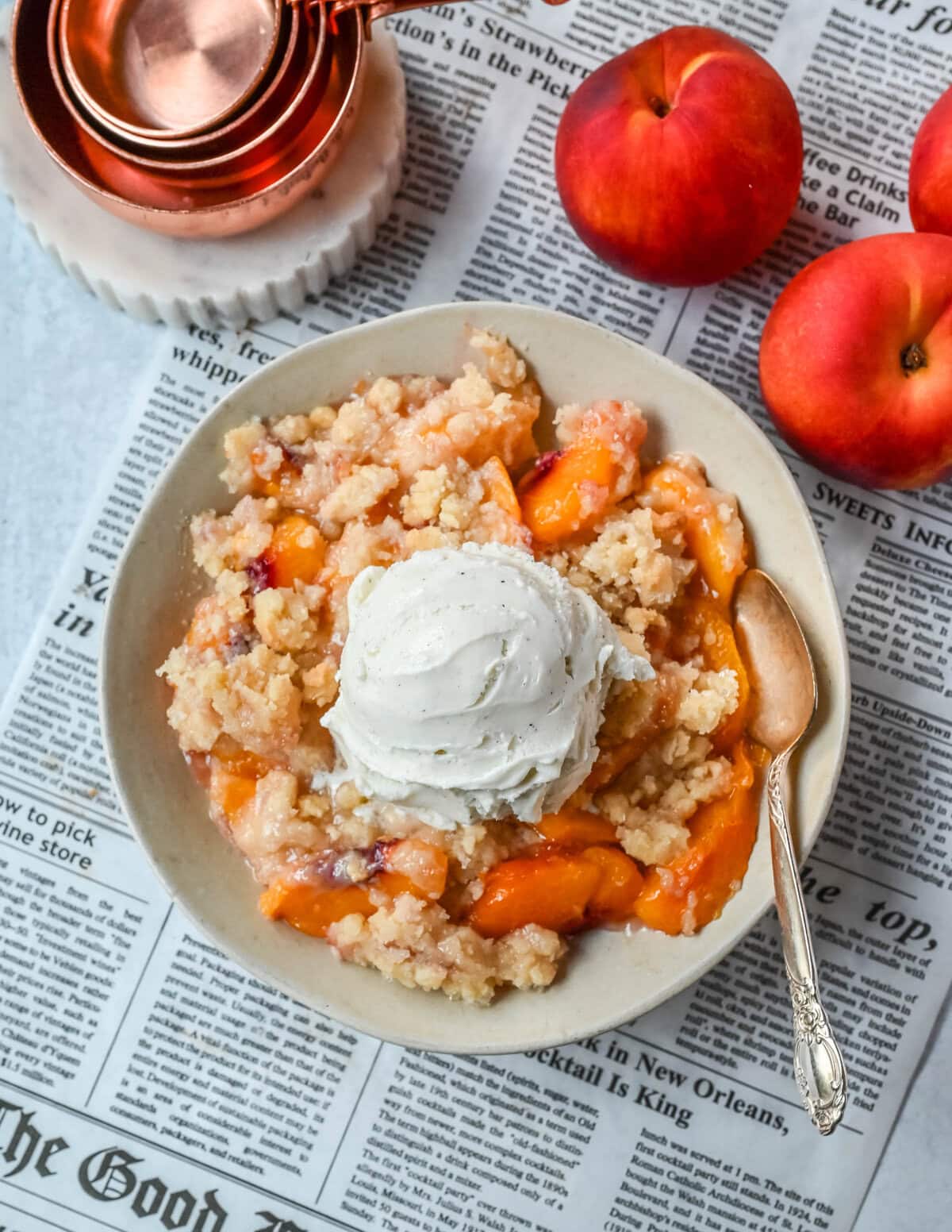 This Homemade Sugar Cookie Peach Cobbler is made with juicy peaches tossed in sugar and topped with a soft, buttery sugar cookie crust, then baked until golden. Serve it warm with a scoop of vanilla ice cream for the best peach cobbler recipe with a sugar cookie twist!