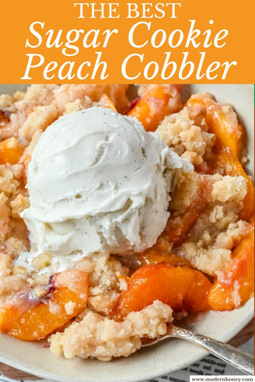This Homemade Sugar Cookie Peach Cobbler is made with juicy peaches tossed in sugar and topped with a soft, buttery sugar cookie crust, then baked until golden. Serve it warm with a scoop of vanilla ice cream for the best peach cobbler recipe with a sugar cookie twist!