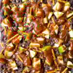 This Caramel Apple Bark is an easy no-bake Fall treat and made with fresh apples, buttery caramel, crunchy pretzels, and rich chocolate. This quick and easy Fall dessert is absolutely delicious and a crowd favorite!