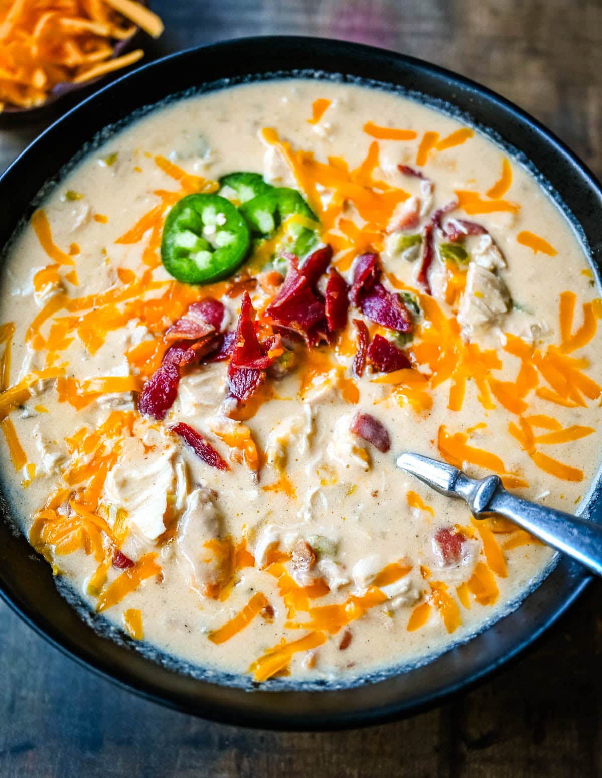 This creamy chicken jalapeño popper soup is everything you love about jalapeño poppers in a cozy bowl. Loaded with bacon, shredded chicken, cream cheese, and cheddar, it’s the ultimate comfort food with a spicy kick. The best jalapeño popper soup!