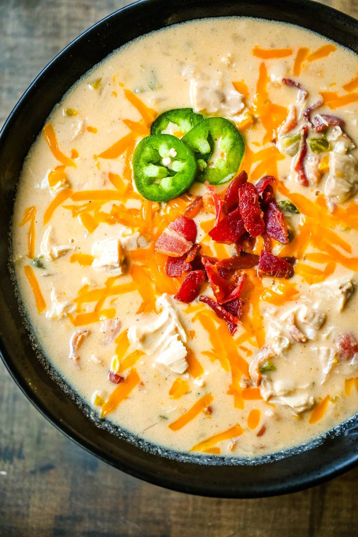 This creamy chicken jalapeño popper soup is everything you love about jalapeño poppers in a cozy bowl. Loaded with bacon, shredded chicken, cream cheese, and cheddar, it’s the ultimate comfort food with a spicy kick. The best jalapeño popper soup!