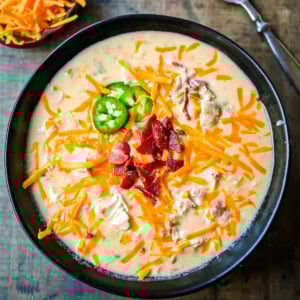 This creamy chicken jalapeño popper soup is everything you love about jalapeño poppers in a cozy bowl. Loaded with bacon, shredded chicken, cream cheese, and cheddar, it’s the ultimate comfort food with a spicy kick. The best jalapeño popper soup!