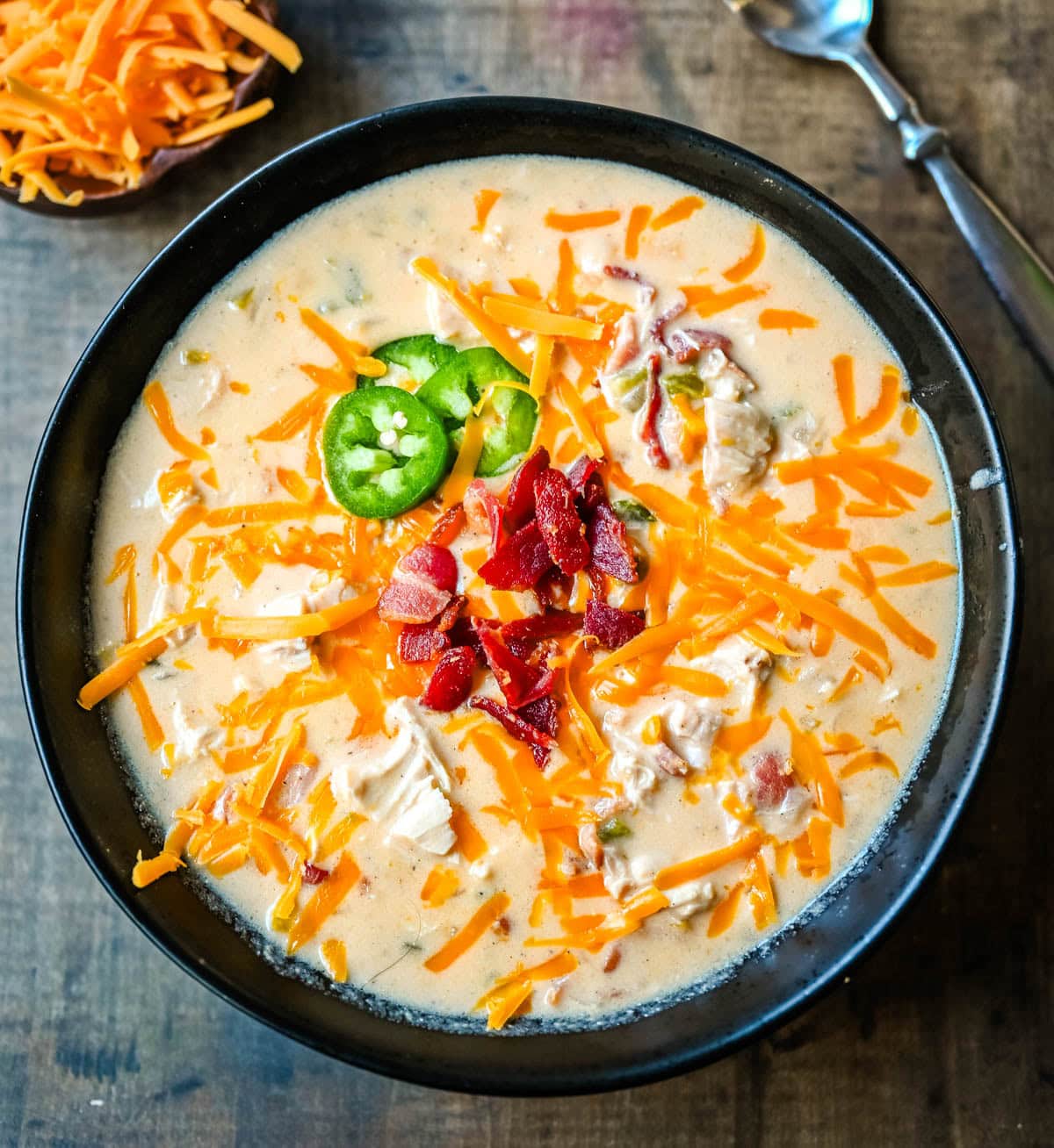 This creamy chicken jalapeño popper soup is everything you love about jalapeño poppers in a cozy bowl. Loaded with bacon, shredded chicken, cream cheese, and cheddar, it’s the ultimate comfort food with a spicy kick. The best jalapeño popper soup!