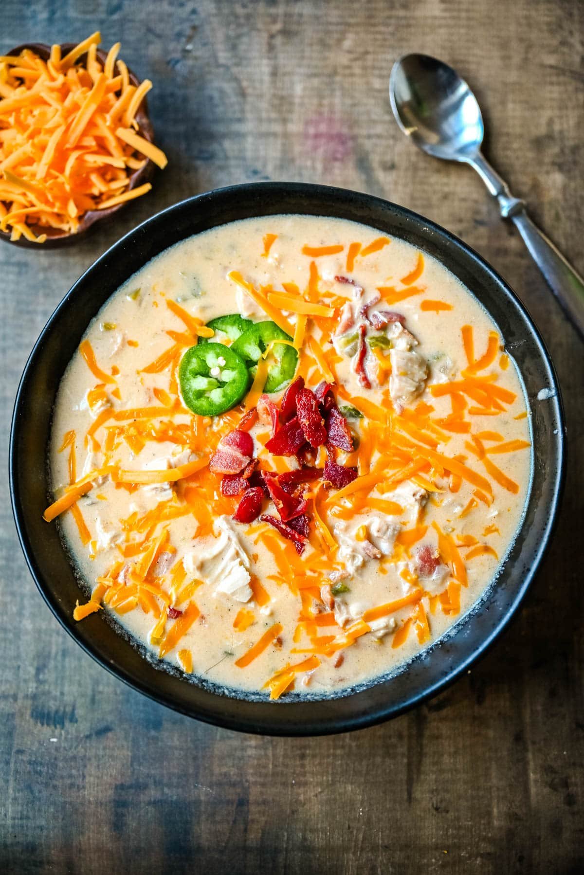 This creamy chicken jalapeño popper soup is everything you love about jalapeño poppers in a cozy bowl. Loaded with bacon, shredded chicken, cream cheese, and cheddar, it’s the ultimate comfort food with a spicy kick. The best jalapeño popper soup!