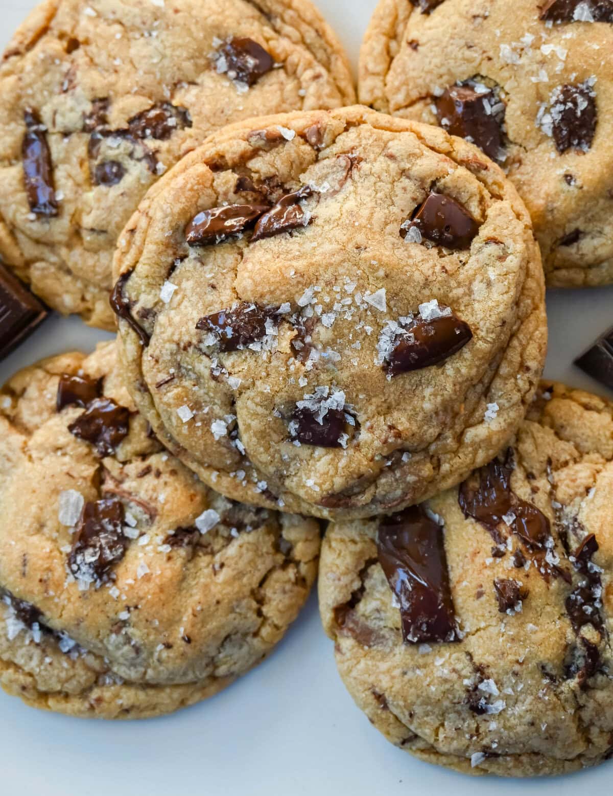 These famous Jacques Torres chocolate chip cookies are soft and chewy, and loaded with bittersweet chocolate discs. With golden edges, a soft center, and a sprinkle of sea salt on top, they’re the ultimate bakery-style chocolate chip cookies you can make at home. These are the New York Times top rated #1 chocolate chip cookie recipe.