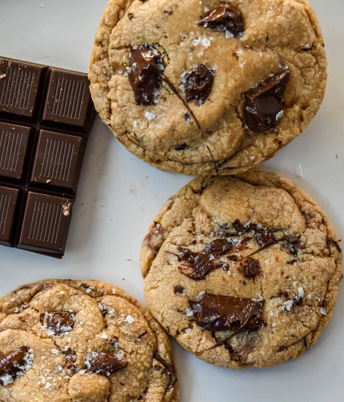 These famous Jacques Torres chocolate chip cookies are soft and chewy, and loaded with bittersweet chocolate discs. With golden edges, a soft center, and a sprinkle of sea salt on top, they’re the ultimate bakery-style chocolate chip cookies you can make at home. These are the New York Times top rated #1 chocolate chip cookie recipe.