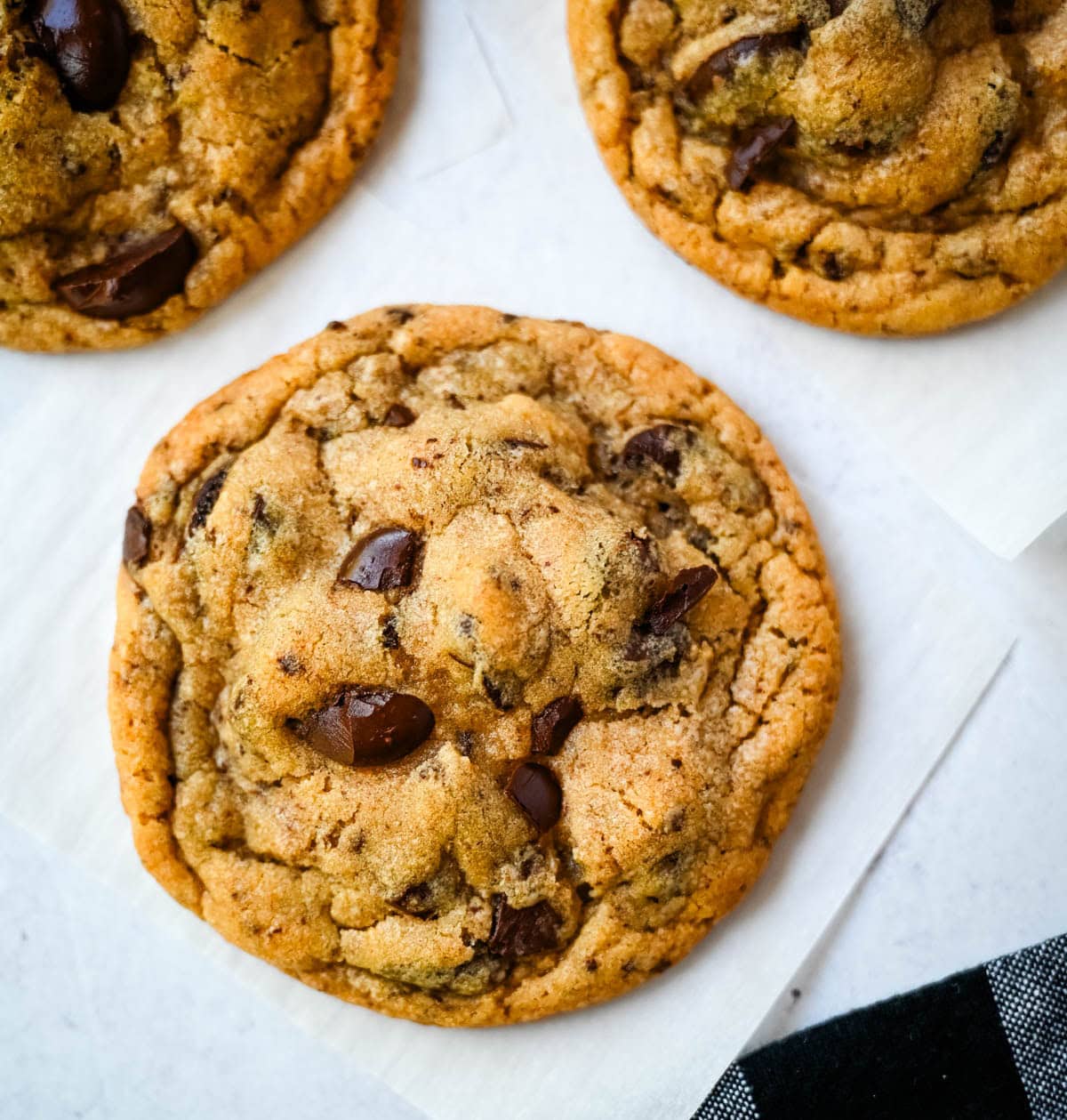 These famous Jacques Torres chocolate chip cookies are soft and chewy, and loaded with bittersweet chocolate discs. With golden edges, a soft center, and a sprinkle of sea salt on top, they’re the ultimate bakery-style chocolate chip cookies you can make at home. These are the New York Times top rated #1 chocolate chip cookie recipe.
