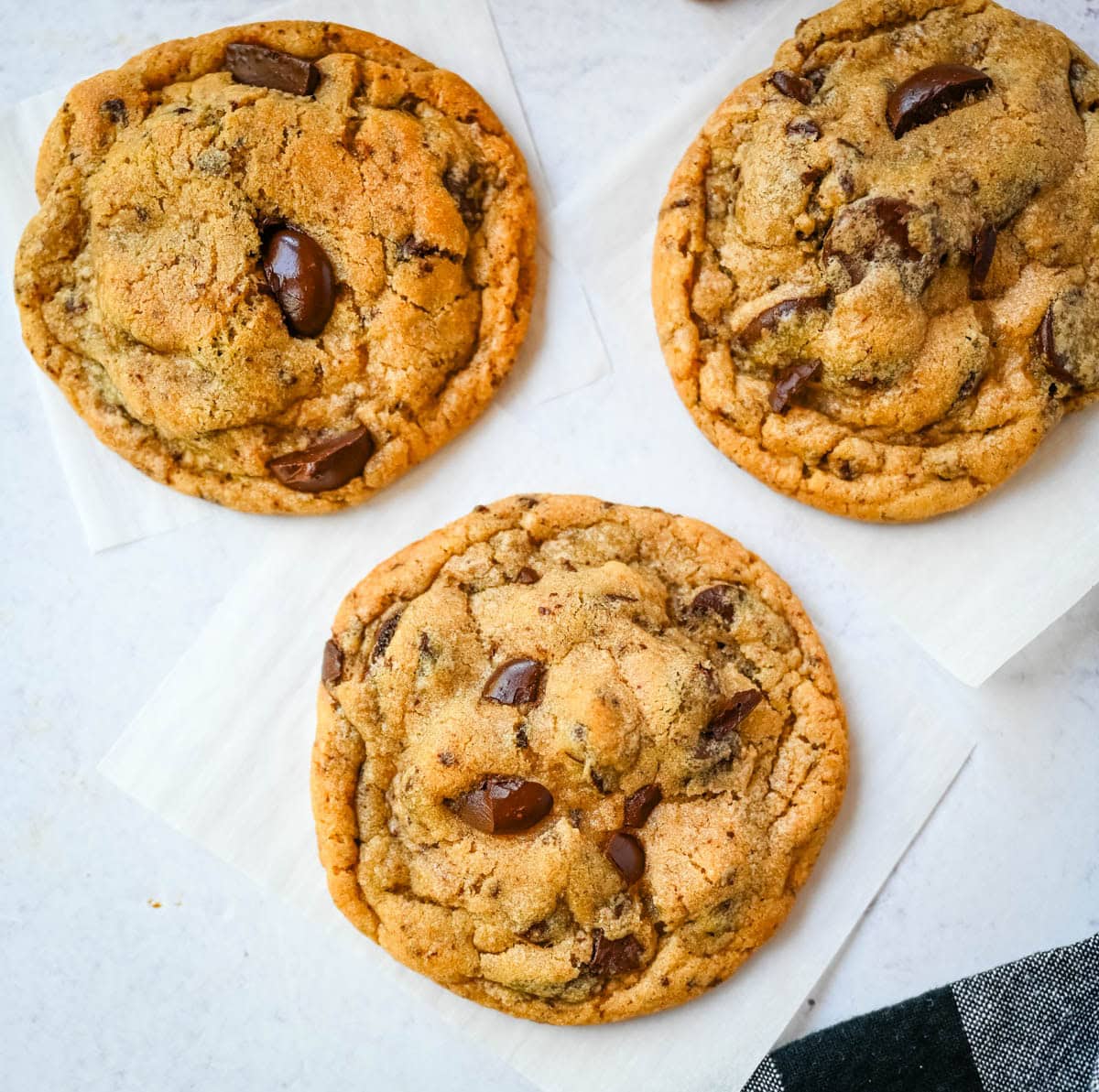 These famous Jacques Torres chocolate chip cookies are soft and chewy, and loaded with bittersweet chocolate discs. With golden edges, a soft center, and a sprinkle of sea salt on top, they’re the ultimate bakery-style chocolate chip cookies you can make at home. These are the New York Times top rated #1 chocolate chip cookie recipe.