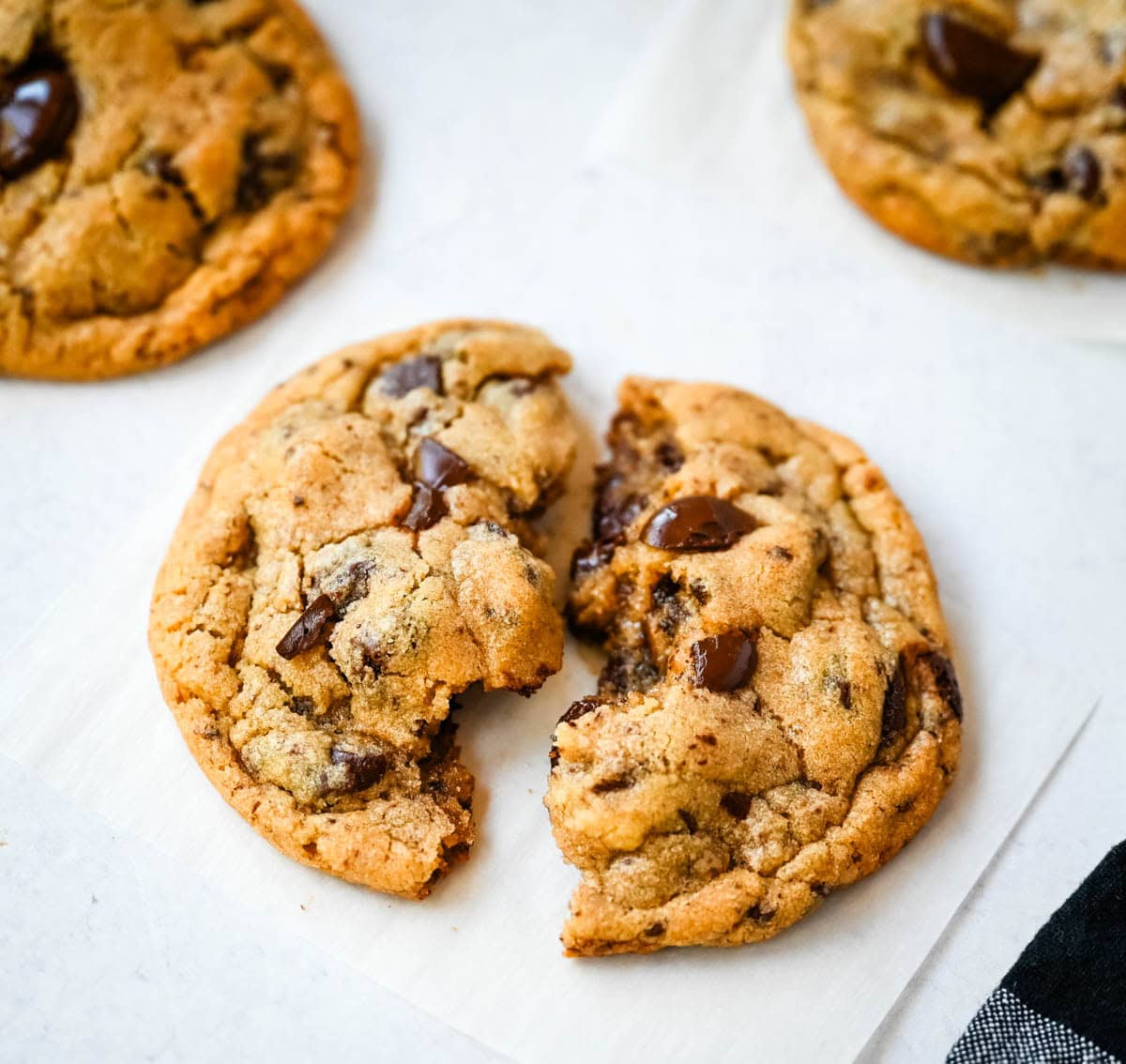 These famous Jacques Torres chocolate chip cookies are soft and chewy, and loaded with bittersweet chocolate discs. With golden edges, a soft center, and a sprinkle of sea salt on top, they’re the ultimate bakery-style chocolate chip cookies you can make at home. These are the New York Times top rated #1 chocolate chip cookie recipe.