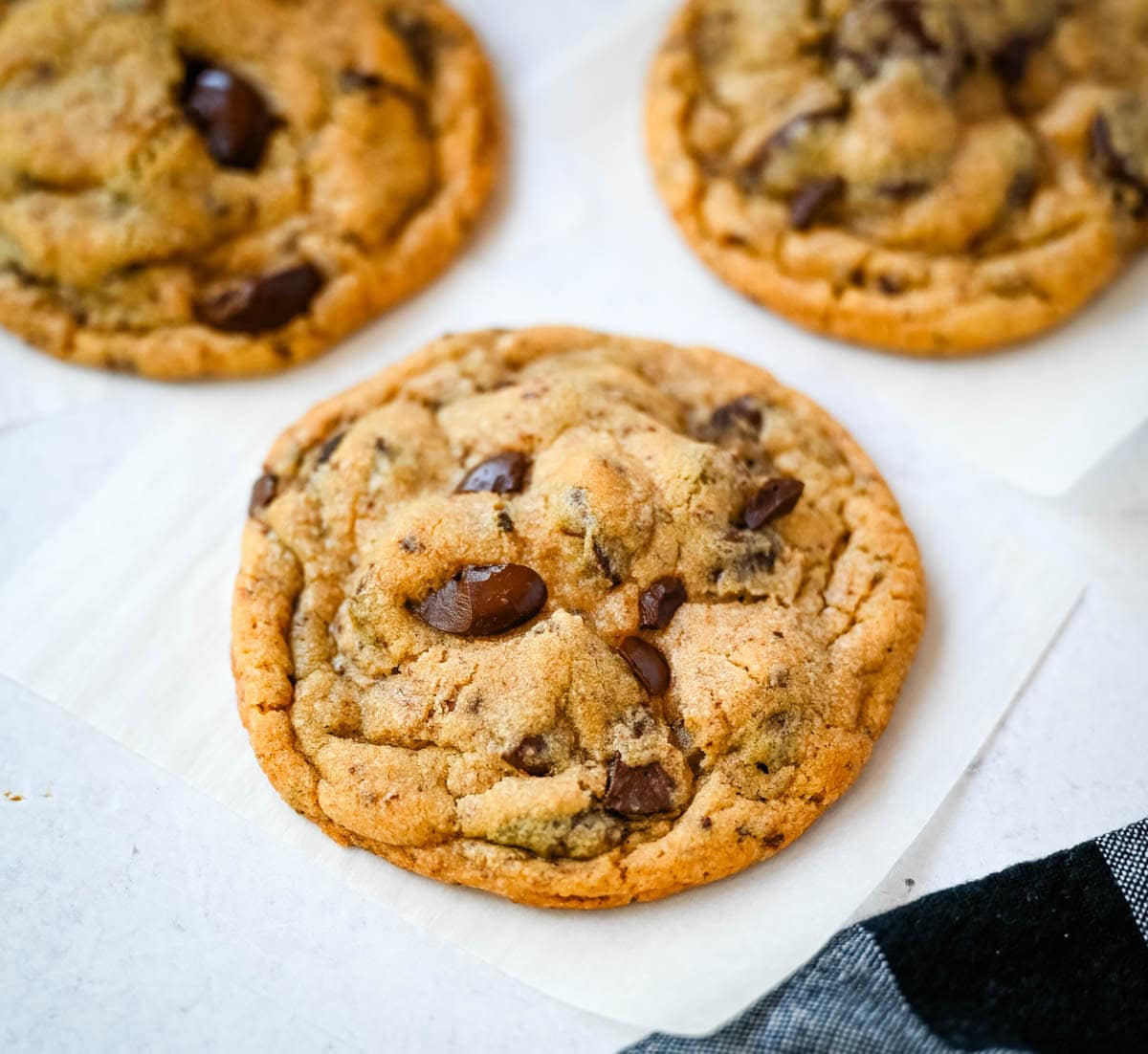 These famous Jacques Torres chocolate chip cookies are soft and chewy, and loaded with bittersweet chocolate discs. With golden edges, a soft center, and a sprinkle of sea salt on top, they’re the ultimate bakery-style chocolate chip cookies you can make at home. These are the New York Times top rated #1 chocolate chip cookie recipe.