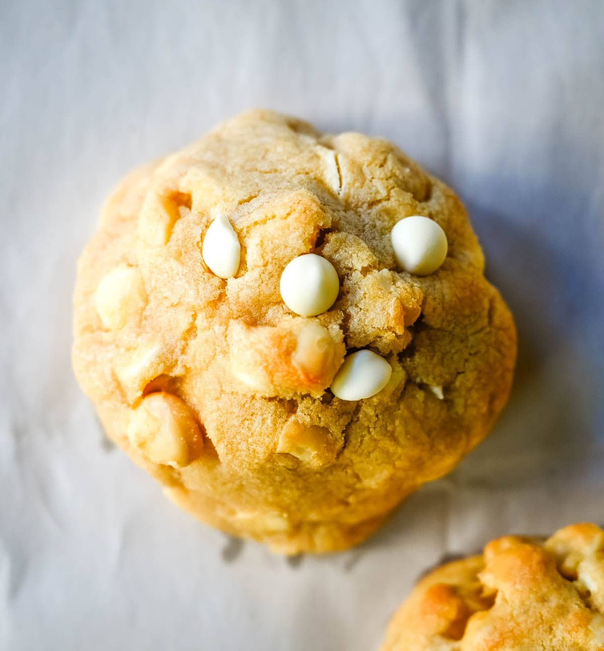 Soft in the center and crisp on the edges, these Levain Bakery White Chocolate Macadamia Cookies taste straight out of the bakery. This White Chocolate Macadamia Nut cookie recipe creates thick, buttery cookies loaded with creamy white chocolate chips and toasted macadamia nuts.