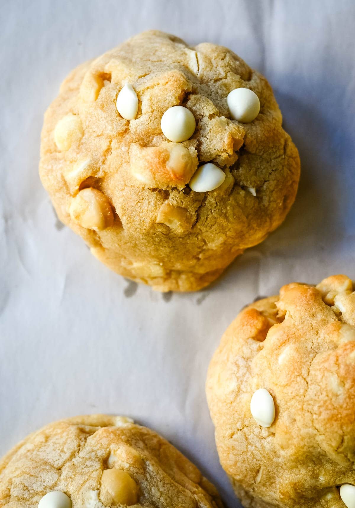 Soft in the center and crisp on the edges, these Levain Bakery White Chocolate Macadamia Cookies taste straight out of the bakery. This White Chocolate Macadamia Nut cookie recipe creates thick, buttery cookies loaded with creamy white chocolate chips and toasted macadamia nuts.