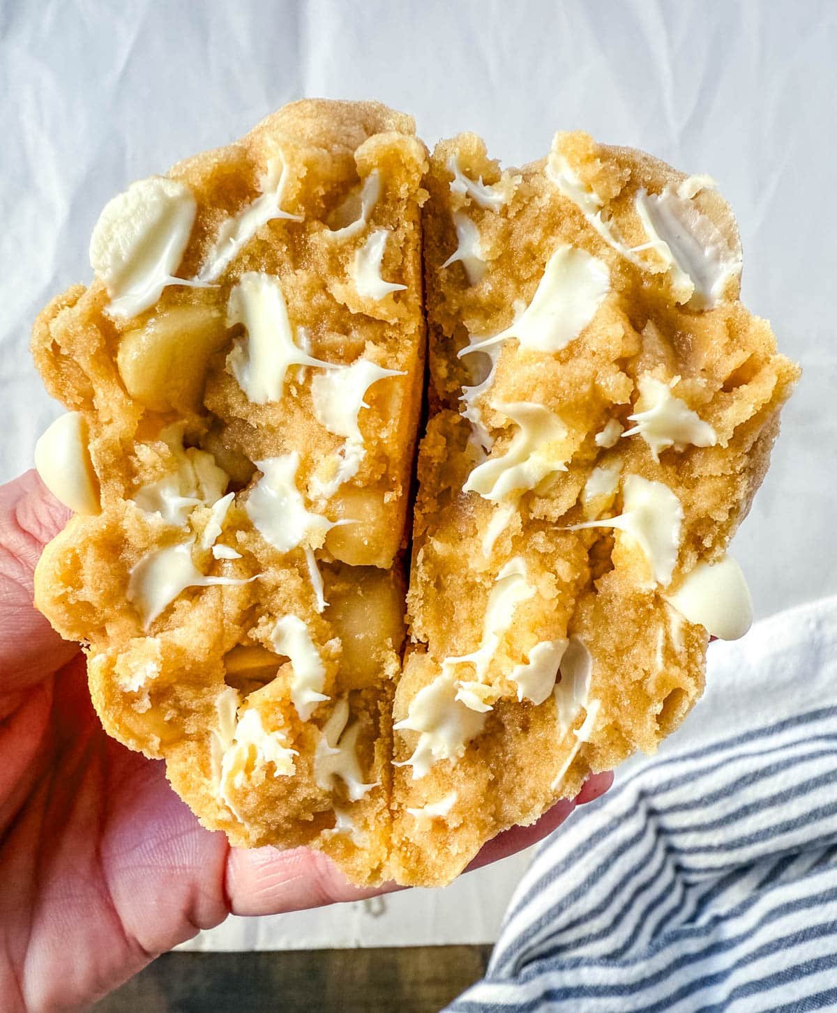 Soft in the center and crisp on the edges, these Levain Bakery White Chocolate Macadamia Cookies taste straight out of the bakery. This White Chocolate Macadamia Nut cookie recipe creates thick, buttery cookies loaded with creamy white chocolate chips and toasted macadamia nuts.
