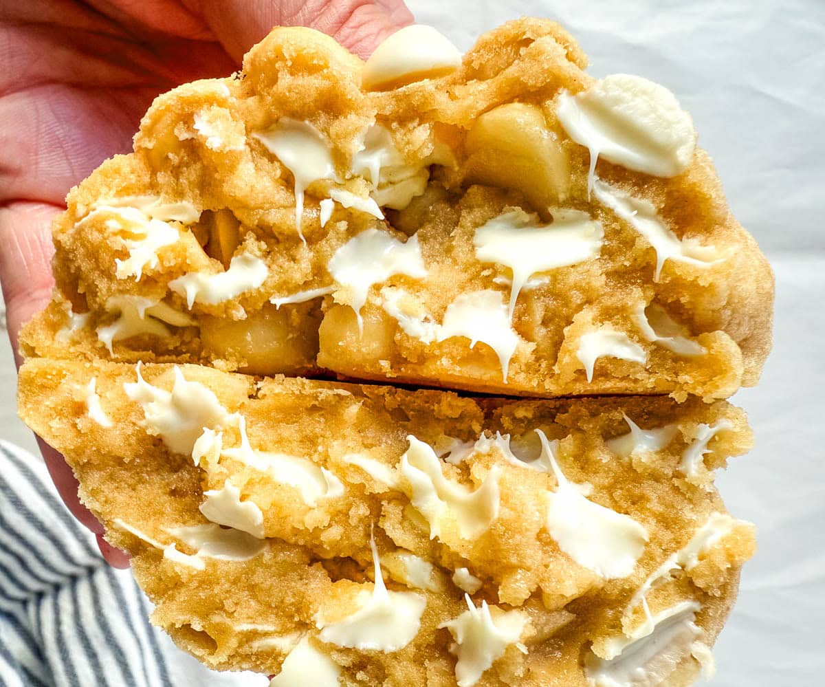 Soft in the center and crisp on the edges, these Levain Bakery White Chocolate Macadamia Cookies taste straight out of the bakery. This White Chocolate Macadamia Nut cookie recipe creates thick, buttery cookies loaded with creamy white chocolate chips and toasted macadamia nuts.