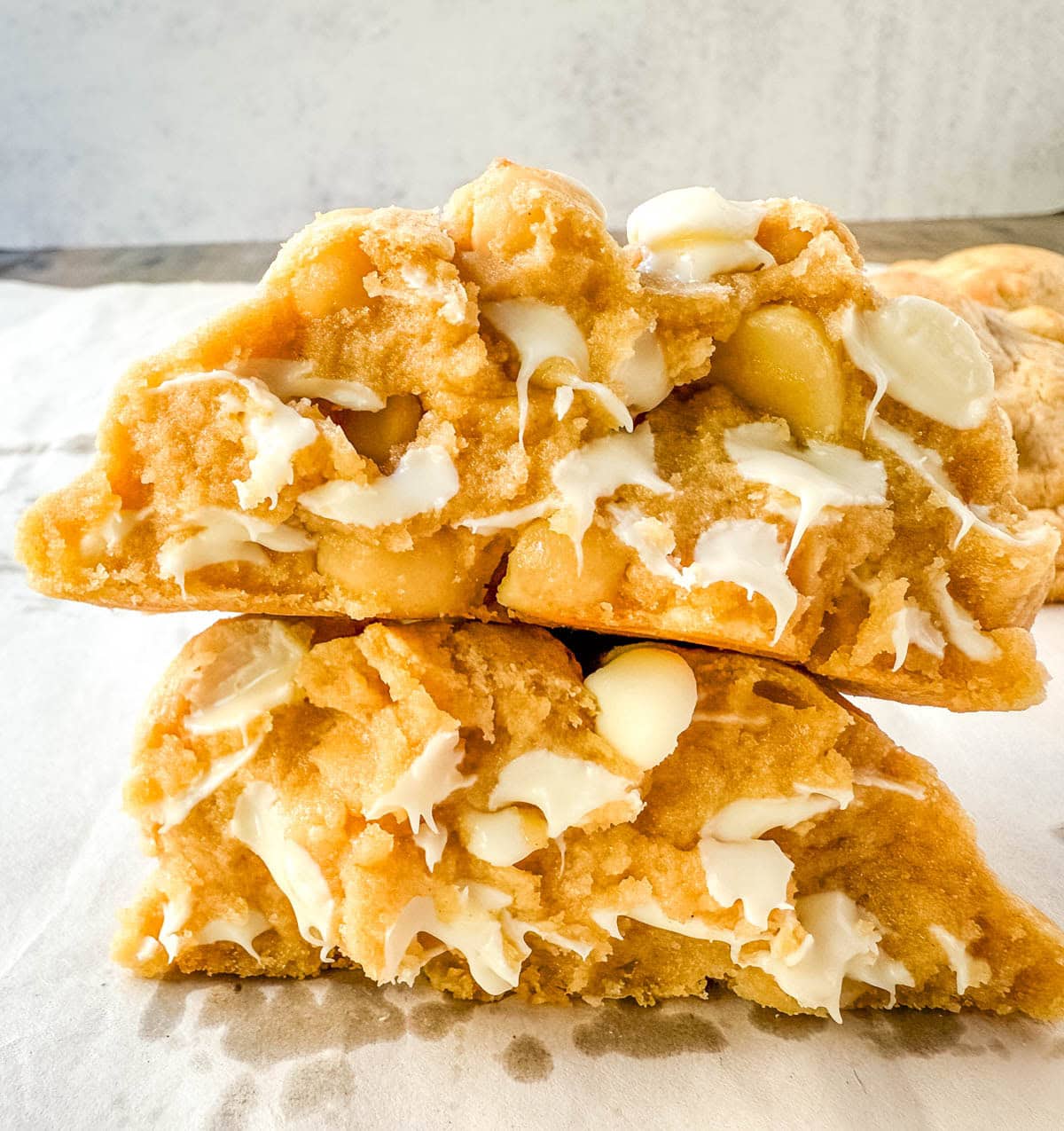 Soft in the center and crisp on the edges, these Levain Bakery White Chocolate Macadamia Cookies taste straight out of the bakery. This White Chocolate Macadamia Nut cookie recipe creates thick, buttery cookies loaded with creamy white chocolate chips and toasted macadamia nuts.