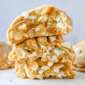 Soft in the center and crisp on the edges, these Levain Bakery White Chocolate Macadamia Cookies taste straight out of the bakery. This White Chocolate Macadamia Nut cookie recipe creates thick, buttery cookies loaded with creamy white chocolate chips and toasted macadamia nuts.