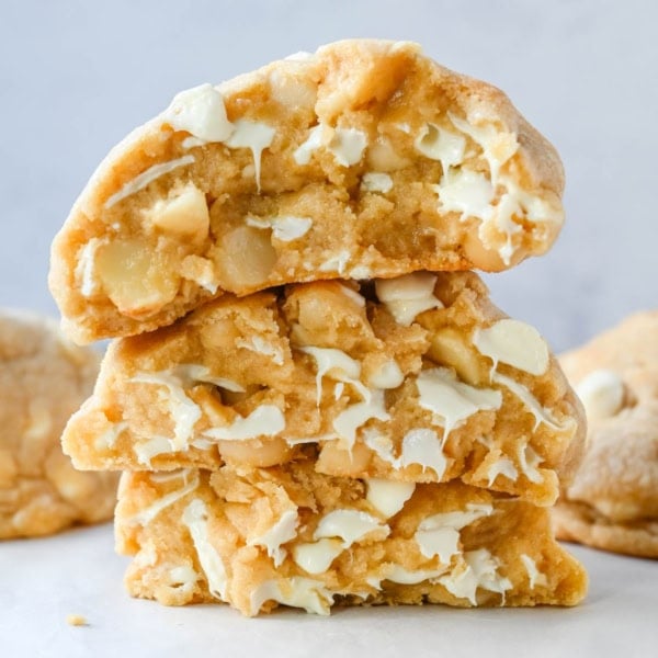 Soft in the center and crisp on the edges, these Levain Bakery White Chocolate Macadamia Cookies taste straight out of the bakery. This White Chocolate Macadamia Nut cookie recipe creates thick, buttery cookies loaded with creamy white chocolate chips and toasted macadamia nuts.
