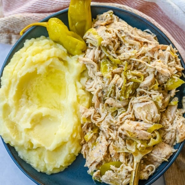 Looking for a new slow cooker chicken recipe? This Slow Cooker Boursin Chicken is rich, creamy, and packed with flavor thanks to garlic herb Boursin cheese, ranch seasoning, and pepperoncini's. The crockpot does all the work, giving you a perfectly tender chicken dinner recipe! You will love this Mississippi Chicken!
