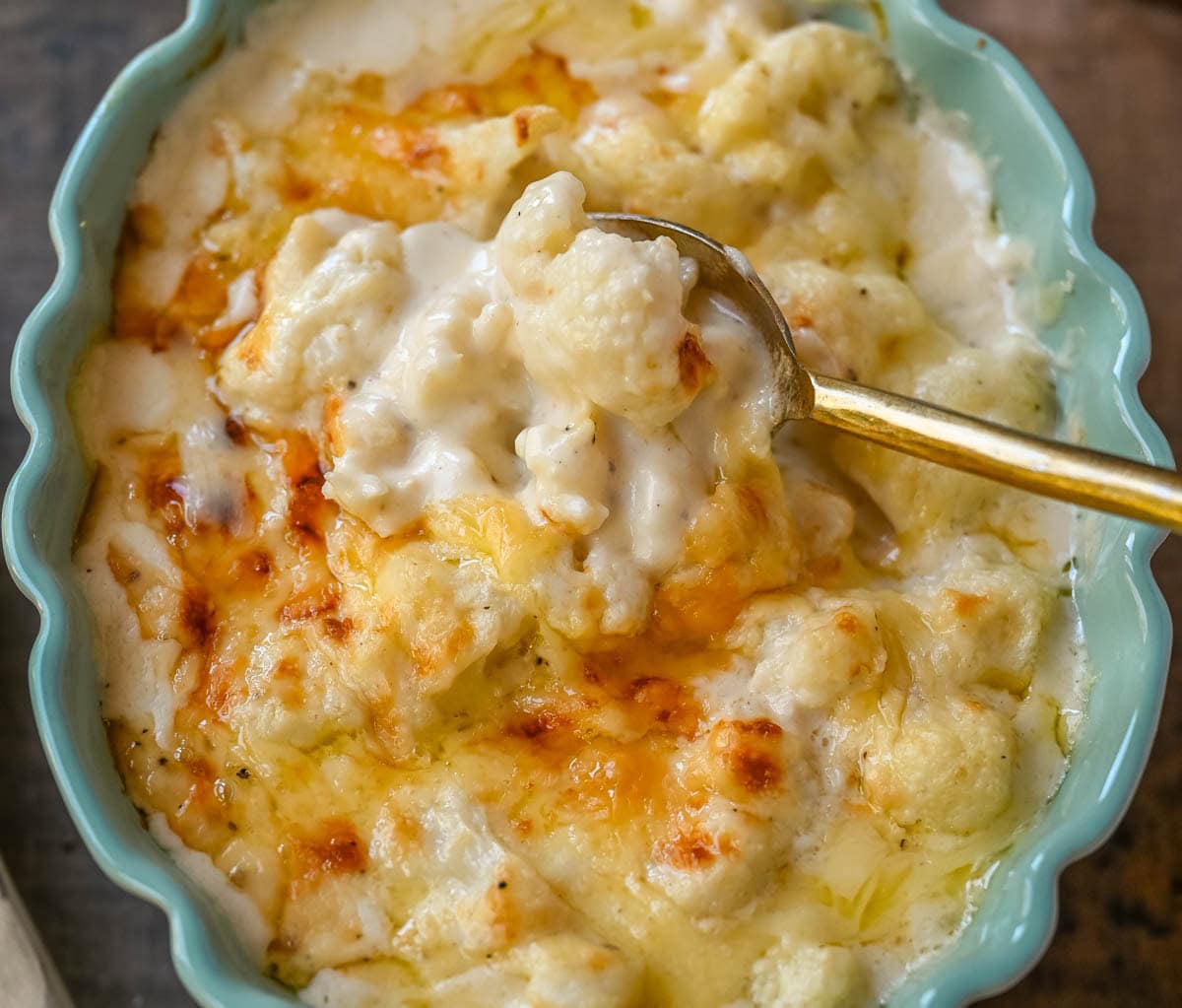 This easy creamy cauliflower gratin is the perfect cheesy side dish for Thanksgiving, Christmas, or any dinner. Made with Gruyère, sharp cheddar, and tender cauliflower, it’s a rich, flavorful, and easy side. The best baked cauliflower gratin!