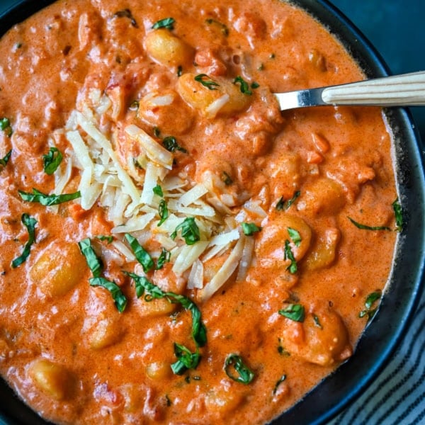 This easy Gnocchi alla Vodka combines soft, tender gnocchi with a silky, tomato-cream vodka sauce that’s bursting with garlic, parmesan, and fresh basil. This Gnocchi with Tomato Cream Sauce is an easy weeknight dinner but it tastes like it is straight out of an Italian restaurant.