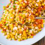 This Hot Honey Skillet Corn recipe is an easy and flavorful side dish made with sweet corn, peppers, onions, and spicy hot honey. It’s a quick corn recipe that's ready in under 20 minutes and pairs perfectly with roasted turkey or chicken.