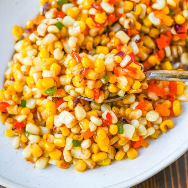 This Hot Honey Skillet Corn recipe is an easy and flavorful side dish made with sweet corn, peppers, onions, and spicy hot honey. It’s a quick corn recipe that's ready in under 20 minutes and pairs perfectly with roasted turkey or chicken.