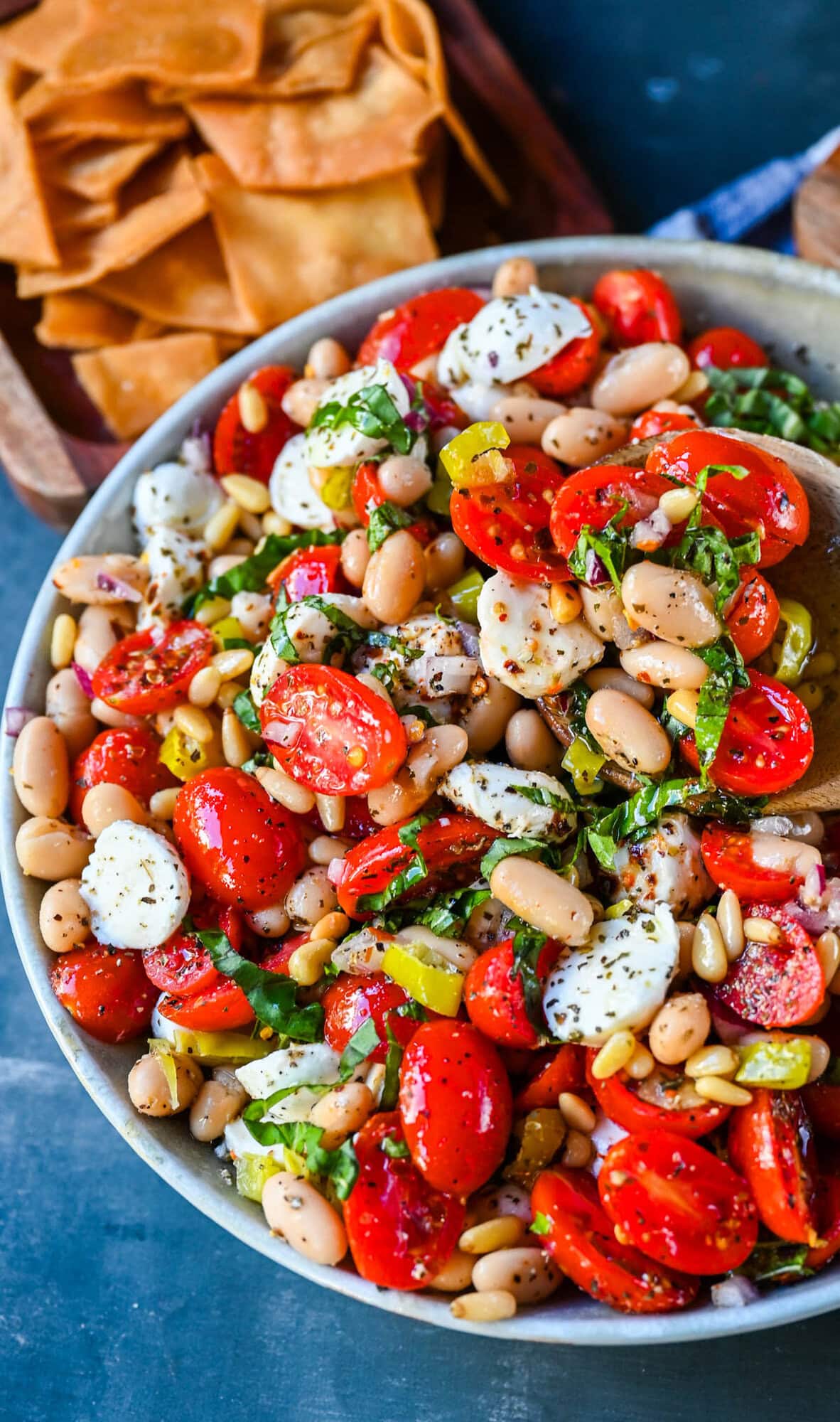 This Italian Cowboy Caviar is a fresh, flavorful twist on the viral cowboy caviar made with juicy tomatoes, creamy mozzarella pearls, tender white beans, pepperoncinis, and basil for a Mediterranean-inspired dip. This easy Italian appetizer comes together in minutes and is perfect for holiday parties, snacking, or meal prep.