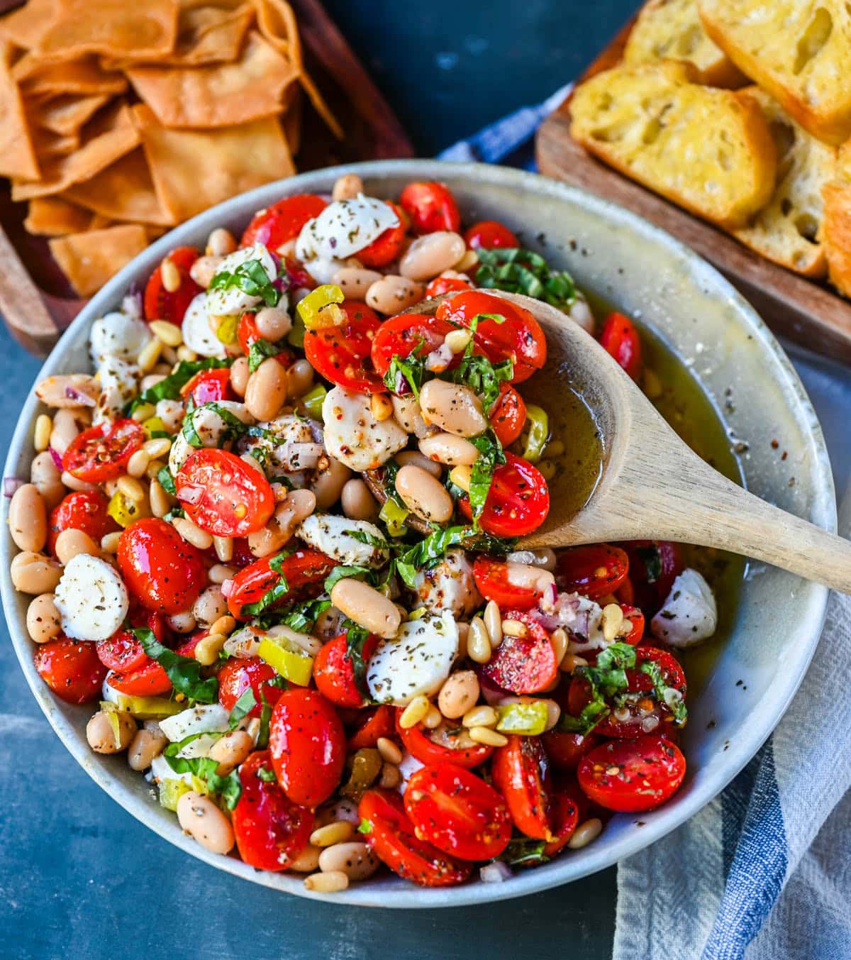 This Italian Cowboy Caviar is a fresh, flavorful twist on the viral cowboy caviar made with juicy tomatoes, creamy mozzarella pearls, tender white beans, pepperoncinis, and basil for a Mediterranean-inspired dip. This easy Italian appetizer comes together in minutes and is perfect for holiday parties, snacking, or meal prep.