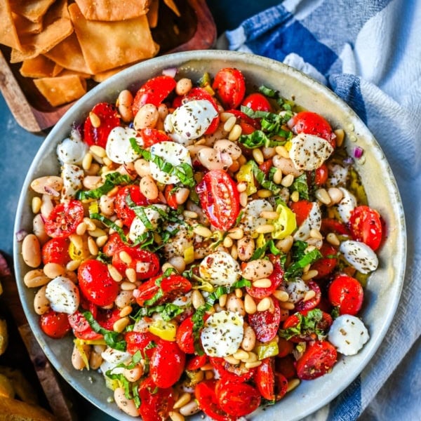 This Italian Cowboy Caviar is a fresh, flavorful twist on the viral cowboy caviar made with juicy tomatoes, creamy mozzarella pearls, tender white beans, pepperoncinis, and basil for a Mediterranean-inspired dip. This easy Italian appetizer comes together in minutes and is perfect for holiday parties, snacking, or meal prep.