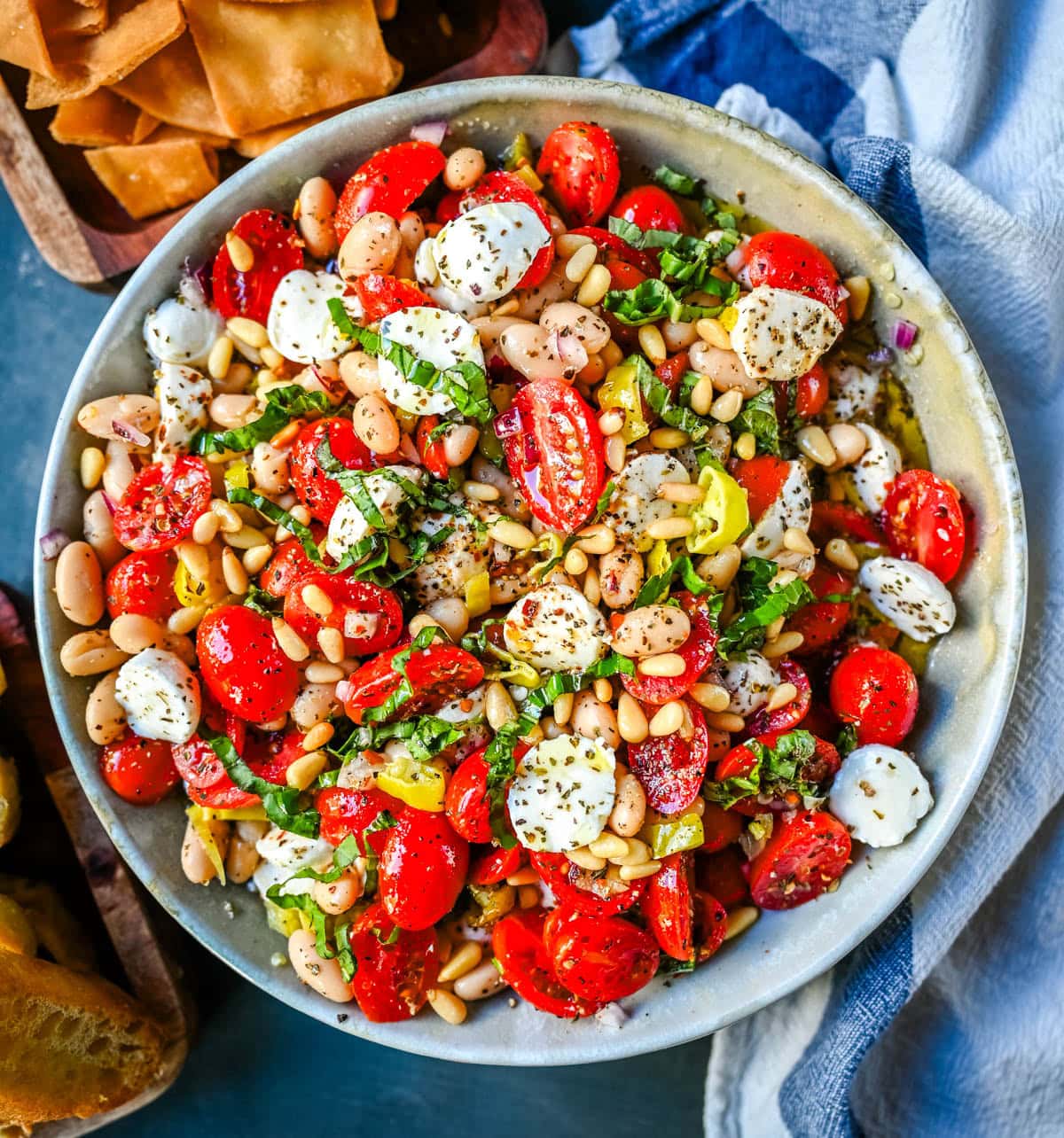 This Italian Cowboy Caviar is a fresh, flavorful twist on the viral cowboy caviar made with juicy tomatoes, creamy mozzarella pearls, tender white beans, pepperoncinis, and basil for a Mediterranean-inspired dip. This easy Italian appetizer comes together in minutes and is perfect for holiday parties, snacking, or meal prep.