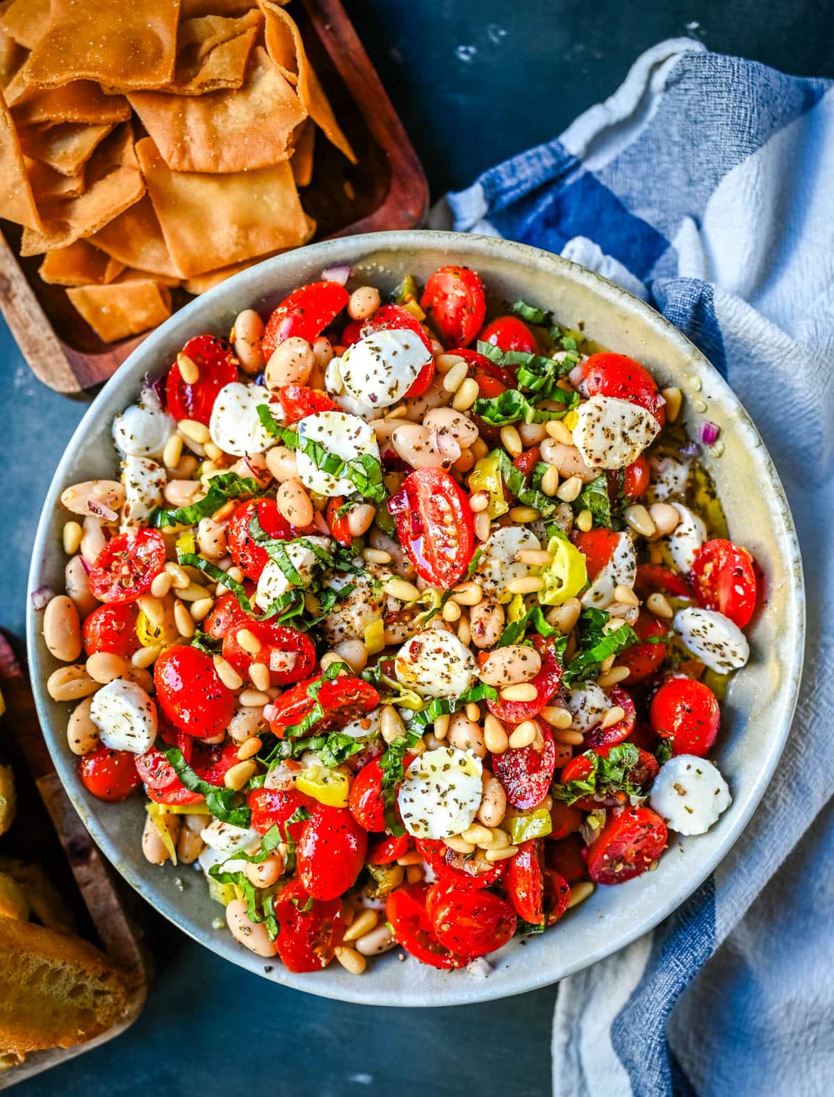 This Italian Cowboy Caviar is a fresh, flavorful twist on the viral cowboy caviar made with juicy tomatoes, creamy mozzarella pearls, tender white beans, pepperoncinis, and basil for a Mediterranean-inspired dip. This easy Italian appetizer comes together in minutes and is perfect for holiday parties, snacking, or meal prep.