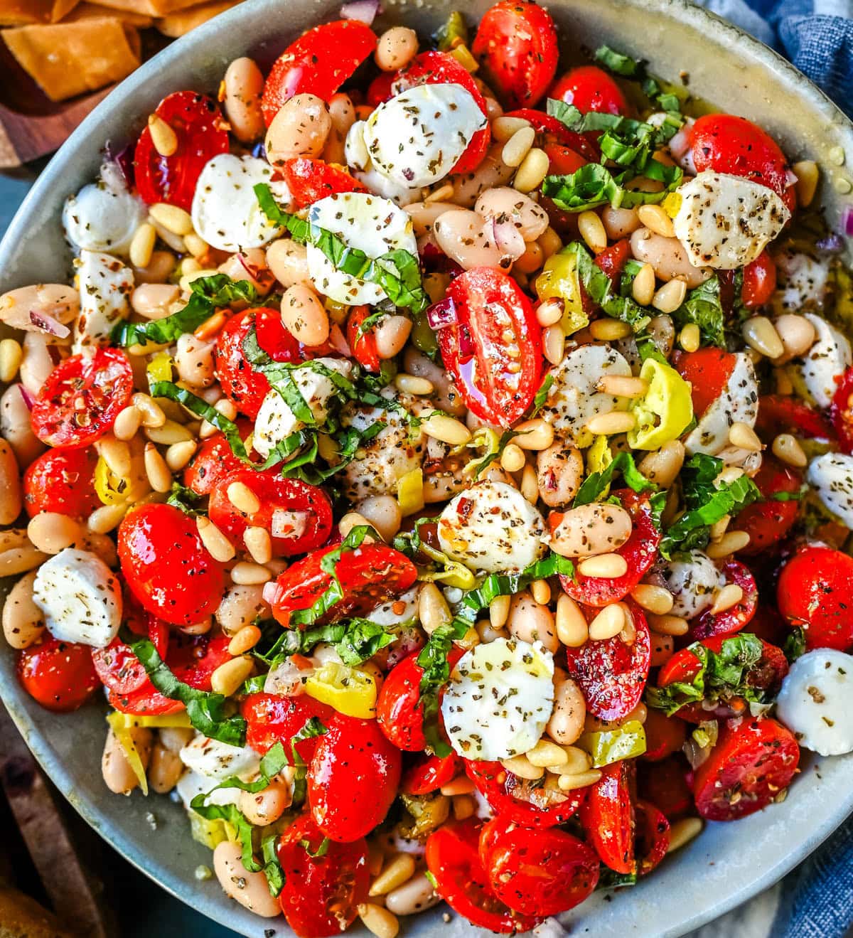 This Italian Cowboy Caviar is a fresh, flavorful twist on the viral cowboy caviar made with juicy tomatoes, creamy mozzarella pearls, tender white beans, pepperoncinis, and basil for a Mediterranean-inspired dip. This easy Italian appetizer comes together in minutes and is perfect for holiday parties, snacking, or meal prep.