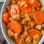 Tender sweet potatoes and apples layered in a silky butter and sugar sauce that thickens into a shiny glaze as it bakes. A timeless fall side dish everyone will love.