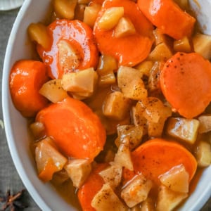 Tender sweet potatoes and apples layered in a silky butter and sugar sauce that thickens into a shiny glaze as it bakes. A timeless fall side dish everyone will love.