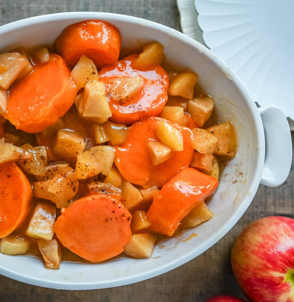 Tender sweet potatoes and apples layered in a silky butter and sugar sauce that thickens into a shiny glaze as it bakes. A timeless fall side dish everyone will love.