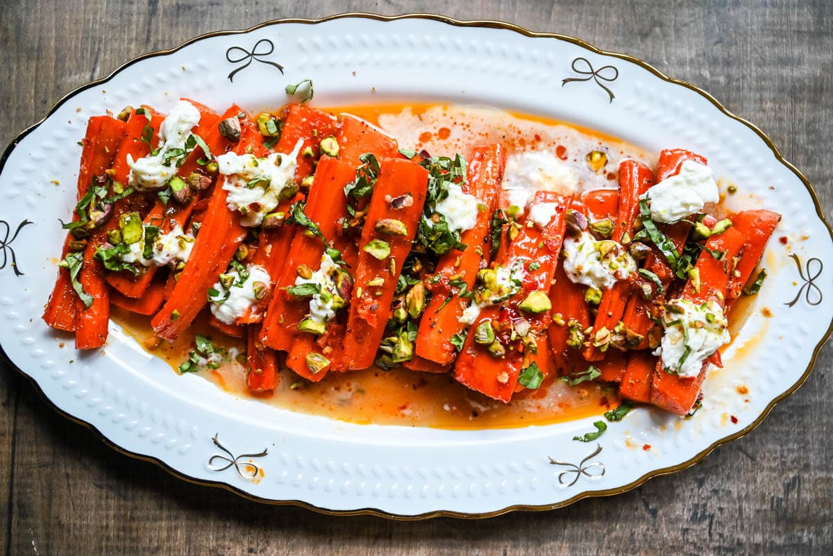 These Sweet and Spicy Roasted Carrots are the perfect combination of sweetness and a warm kick from the Calabrian chili paste. Topped with creamy burrata, crunchy pistachios, and fresh basil, this side dish feels restaurant-worthy but is incredibly easy to make at home. The best roasted carrot side dish recipe!
