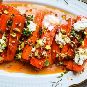 These Sweet and Spicy Roasted Carrots are the perfect combination of sweetness and a warm kick from the Calabrian chili paste. Topped with creamy burrata, crunchy pistachios, and fresh basil, this side dish feels restaurant-worthy but is incredibly easy to make at home. The best roasted carrot side dish recipe!