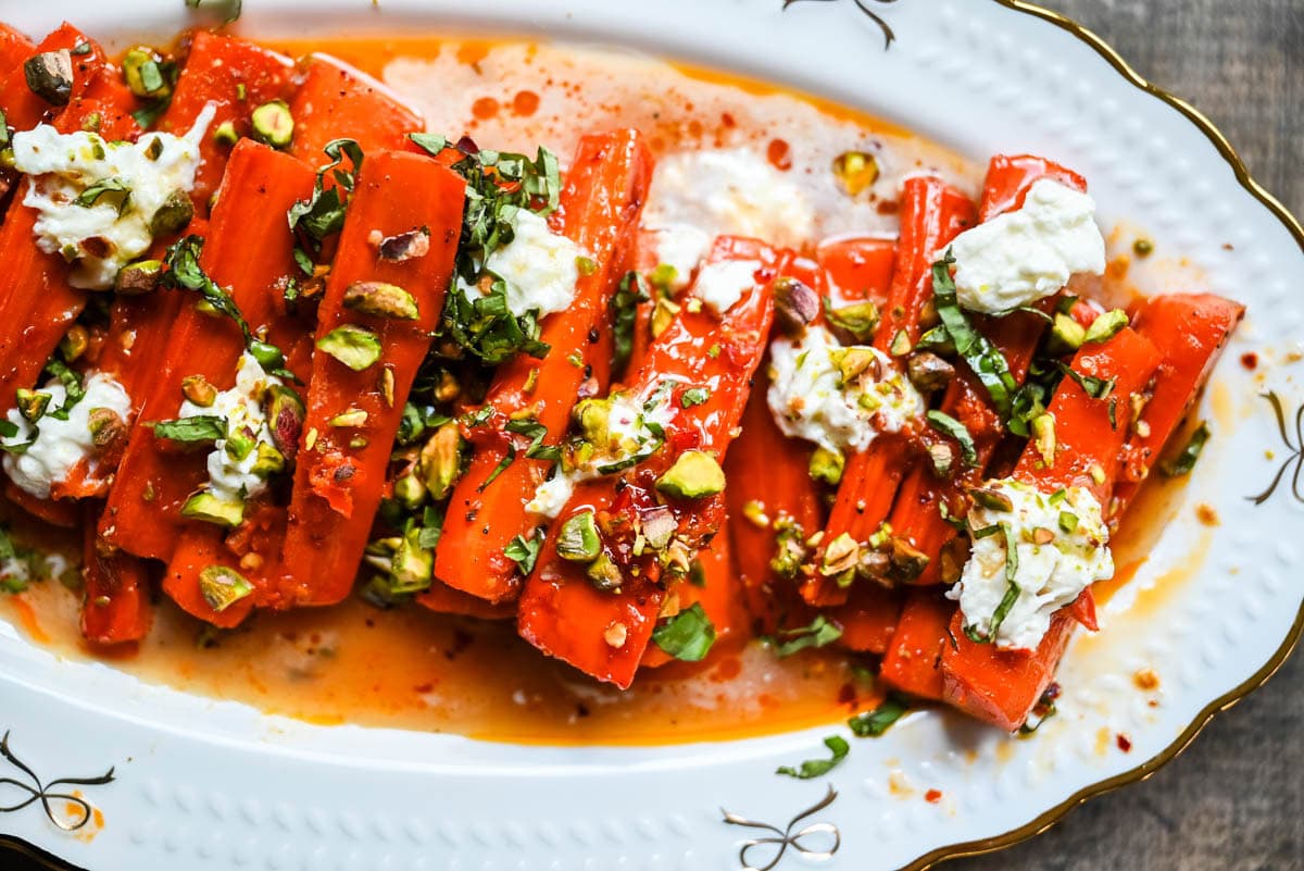 These Sweet and Spicy Roasted Carrots are the perfect combination of sweetness and a warm kick from the Calabrian chili paste. Topped with creamy burrata, crunchy pistachios, and fresh basil, this side dish feels restaurant-worthy but is incredibly easy to make at home. The best roasted carrot side dish recipe!