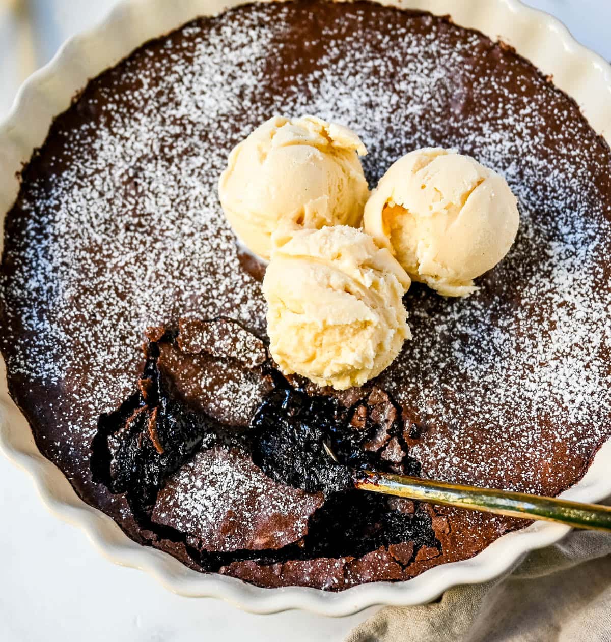 Brownie pudding is the viral, ultra-rich chocolate dessert combining the best parts of brownies and molten lava cake. This easy dessert bakes into a crackly top with a gooey, fudgy, pudding-like center that is chocolate lover's dream dessert. Made famous by Ina Garten, brownie pudding is trending everywhere on TikTok, thanks to its simple ingredients, decadent texture, and rich flavor. You will love Ina Garten's Brownie Pudding recipe!