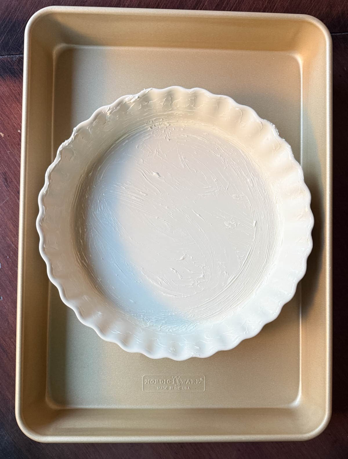 Prepare pan for baking Ina Garten brownie pudding recipe.